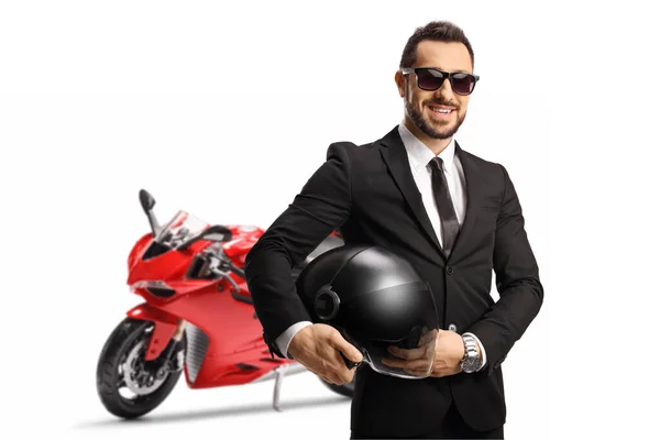 Empresario Sosteniendo Casco Posando Con Una Moto Roja Aislada Sobre —  Fotos de Stock