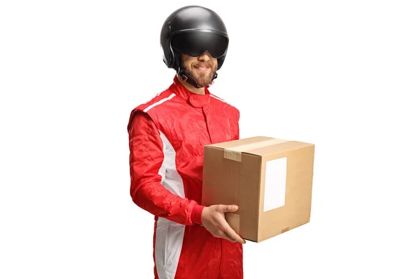 Man Racing Suit Helmet Holding Cardboard Box Isolated White Background — Stock Photo, Image