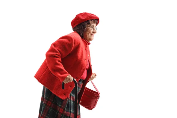 Beyaz Arka Planda Soyutlanmış Bastonla Yürüyen Yaşlı Bir Kadın — Stok fotoğraf