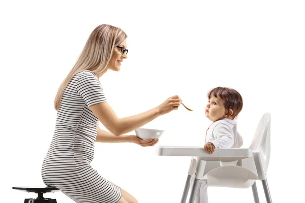 Mother Feeding Baby Seated Chair Isolated White Background — ストック写真