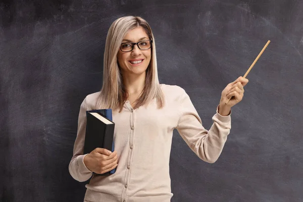 Female Teacher Standing Front Blackboard Pointing Stick — Stock Photo, Image