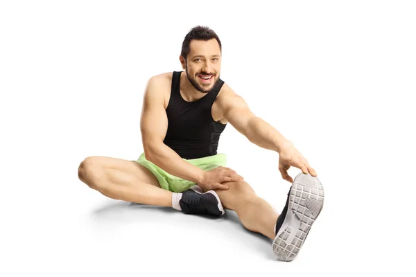 Young Man Sportswear Sitting Floor Stretching Isolated White Background — ストック写真