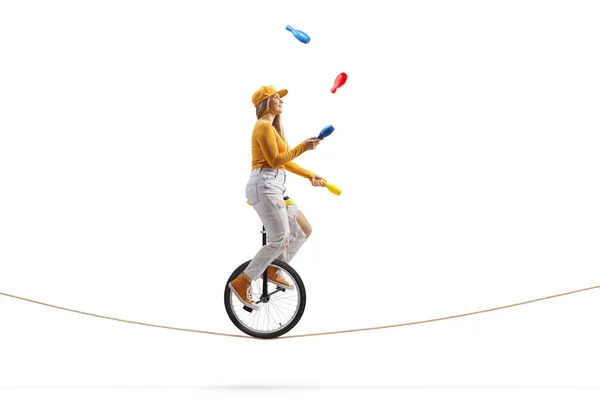 Young Female Riding Unicycle Tightrope Juggling Isolated White Background — Stock Photo, Image