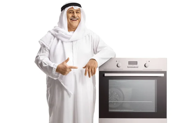 Mature Arab Man Leaning Oven Pointing Isolated White Background — стоковое фото