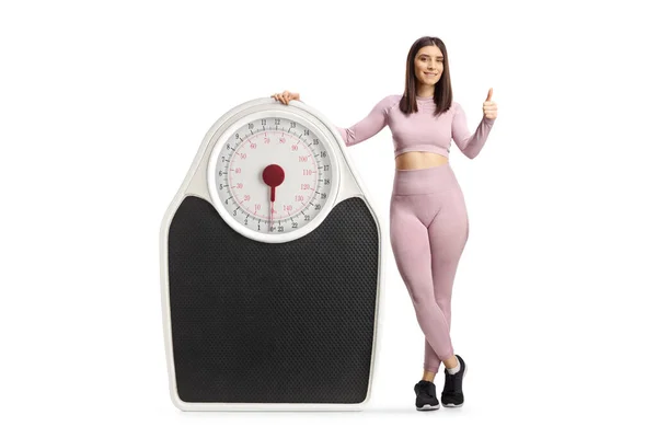 Young Fit Woman Sportswear Posing Big Scale Showing Thumbs Isolated — 스톡 사진