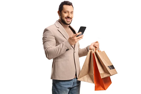 Man Holding Smartphone Shopping Bags Smiling Camera Isolated White Background — ストック写真