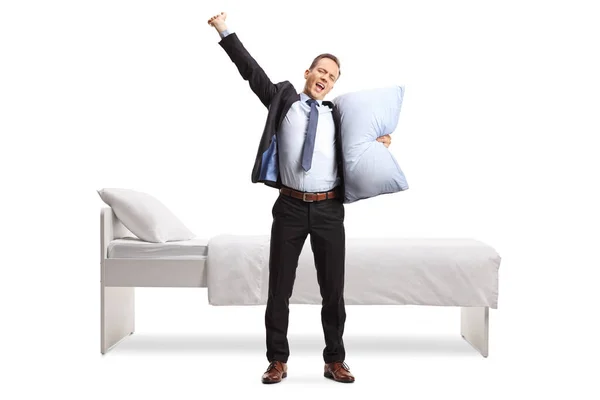 Full Length Portrait Businessman Holding Pillow Yawning Front Bed Isolated — стоковое фото