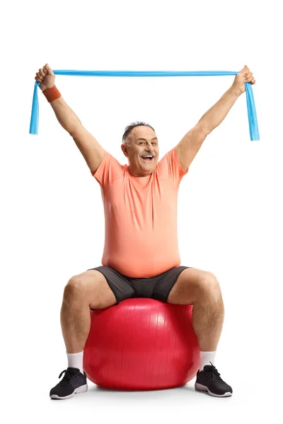 Smiling Mature Man Sportswear Sitting Fitness Ball Exercising Elastic Band — Stock Photo, Image