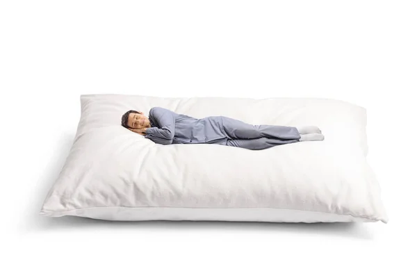 Молодой Человек Пижаме Мирно Спит Большой Подушке Изолированной Белом Фоне — стоковое фото