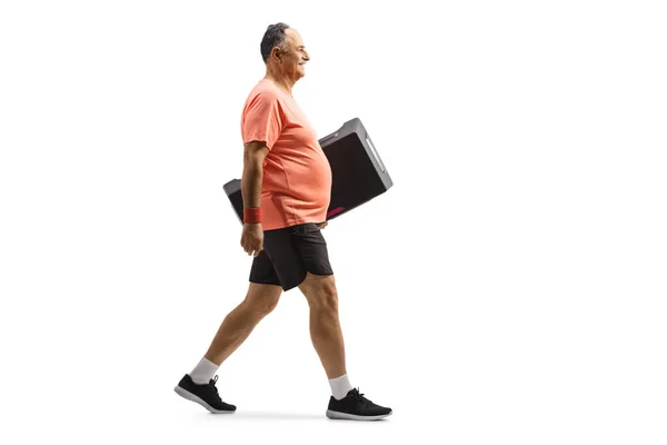 Full Length Profile Shot Mature Man Sportswear Walking Carring Step — стоковое фото