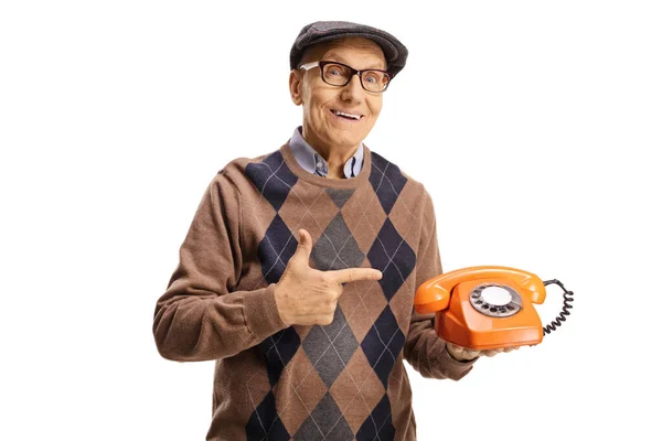 Elderly Man Holding Old Vintage Rotary Phone Pointing Isolated White — стоковое фото