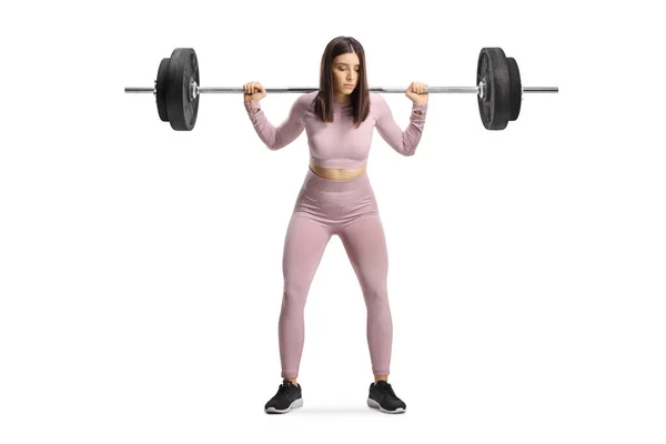 Sportieve Vrouwelijke Staande Tillen Zware Gewichten Schouders Geïsoleerd Witte Achtergrond — Stockfoto