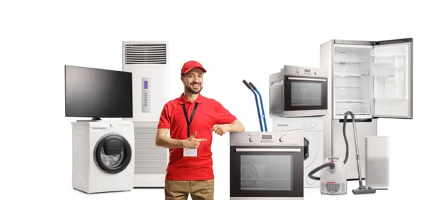 Male Shop Assistant Store Electrical Appliances Pointing Oven Isolated White — Stock Photo, Image
