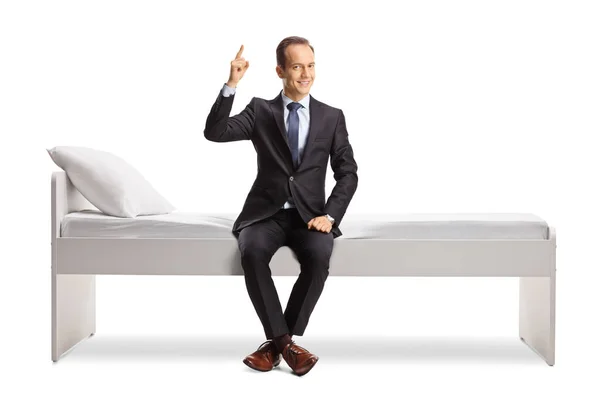 Businessman Sitting Bed Pointing Isolated White Background — 스톡 사진