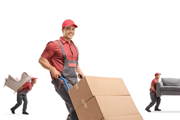 Mover Pushing Hand Truck Other Workers Carrying Furniture Isolated White — Stock Photo, Image