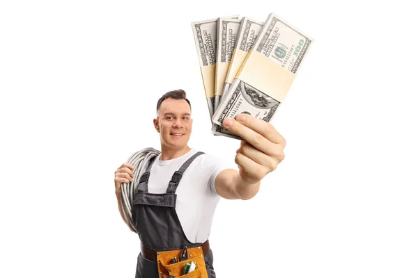 Electrician Carrying Cables His Shoulder Holding Stacks Money Isolated White — Fotografia de Stock