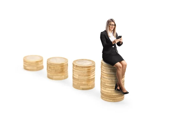 Businesswoman Sitting Piles Coins Using Smartphone Isolated White Background — Stock fotografie