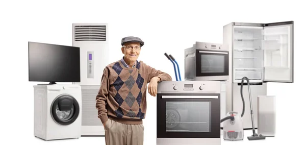 Elderly Man Posing Different Electrical Household Appliances Isolated White Background — Stockfoto