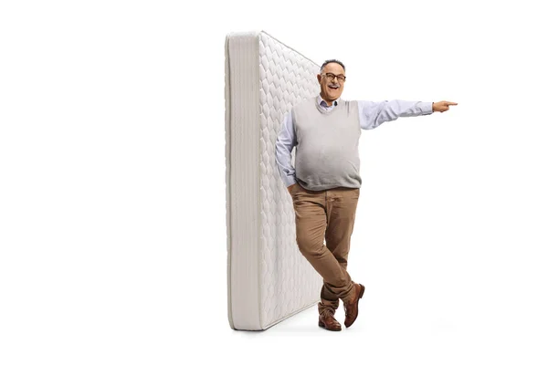 Full Length Portrait Mature Man Leaning King Bed Mattress Pointing — Stock Fotó