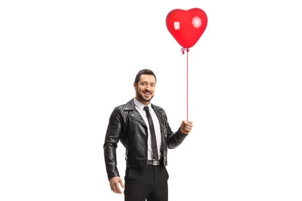 Man Leather Jacket Holding Red Heart Balloon Smiling Isolated White — Stock fotografie