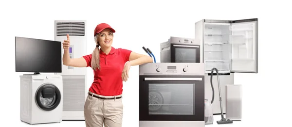 Female Shop Assistant Home Electrical Appliances Gesturing Thumbs Isolated White — Stockfoto
