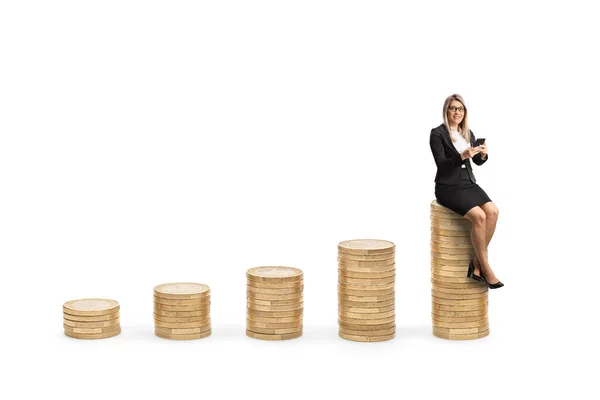 Young Professional Woman Sitting Piles Coins Using Mobile Phone Isolated — Stock fotografie