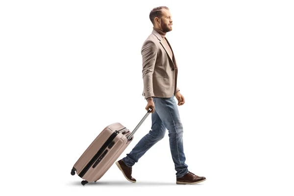 Full Length Profile Shot Man Walking Pulling Suitcase Isolated White — ストック写真