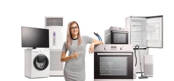 Female Customer Pointing Electrcal Oven Other Home Appliances Isolated White — Φωτογραφία Αρχείου