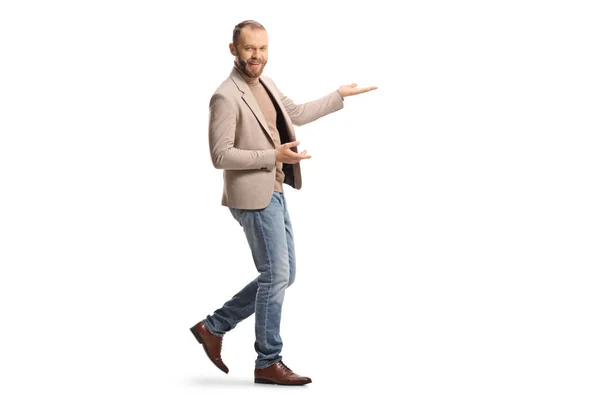 Full Length Shot Young Man Headset Showing Something Hands Isolated — Fotografia de Stock