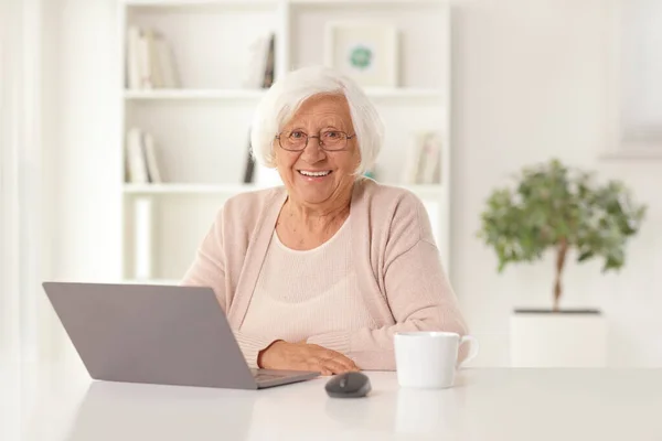 Happy Elderly Woman Sitting Home Laptop Computer Table — Foto Stock