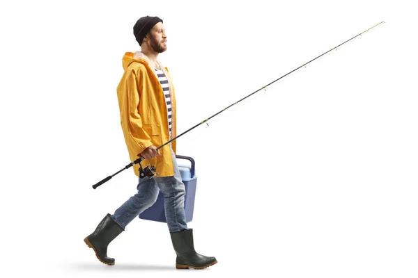 Full Length Profile Shot Fisherman Raincoat Walking Carrying Portable Fridge — Stok fotoğraf