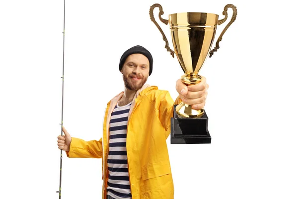 Happy Young Fisherman Holding Fishing Rod Showing Gold Trophy Cup — Zdjęcie stockowe