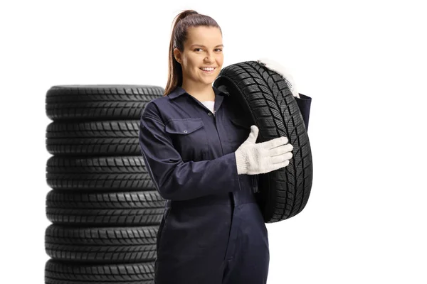 Pile Tires Young Female Mechanic Worker Carrying Tire Isolated White — Stock Photo, Image