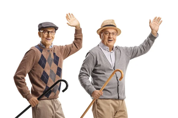 Radosne Dwóch Starszych Mężczyzn Chodzącymi Laskami Machających Kamery Odizolowanych Białym — Zdjęcie stockowe