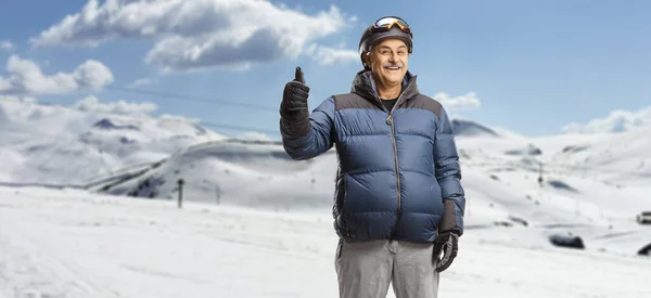 Mature Man Winter Jacket Standing Ski Resort Snowy Mountain Gesturing — Stock Photo, Image