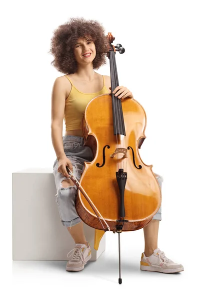 Young Female Musician Sitting White Cube Cello Smiling Isolated White — Stock Photo, Image