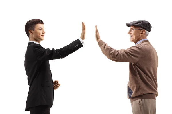 Profile Shot Young Man Suit Greeting Elderly Man High Five — Stock Photo, Image
