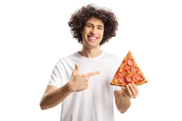 Glad Ung Man Som Håller Bit Pizza Och Pekar Isolerad — Stockfoto