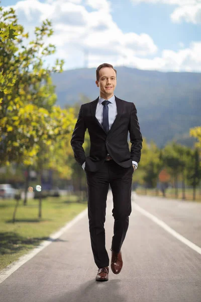 Businessman Walking Camera Hands Pockets Outdoors Pedestrian Lane — Stock Photo, Image