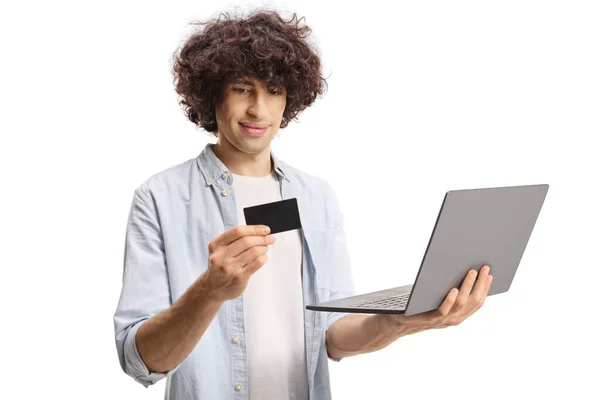 Casual Guy Holding Laptop Computer Looking Credit Card Isolated White — Stockfoto