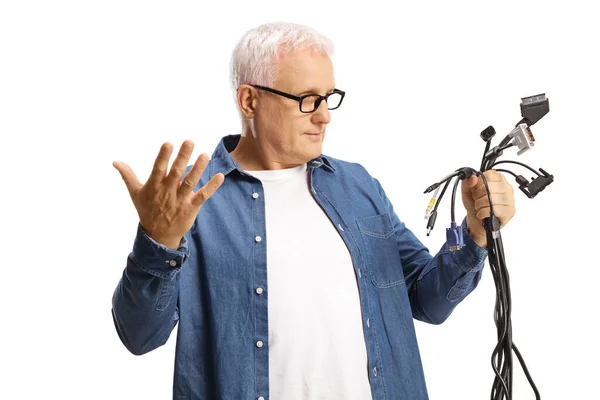 Mature Man Holding Many Cables Wondering What Isolated White Background — Stockfoto