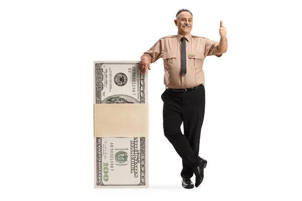 Security Officer Leaning Stack Dollars Gesturing Thumbs Isolated White Background — Stock Photo, Image
