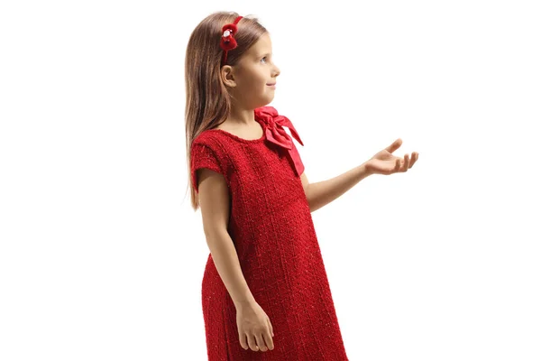 Kırmızı Elbiseli Küçük Bir Kızın Profil Fotoğrafı Elini Önde Tutuyor — Stok fotoğraf