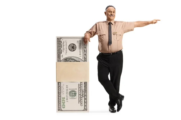 Security Officer Leaning Stack Money Pointing Isolated White Background — Stock Photo, Image
