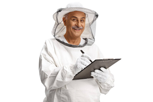 Mature male bee keeper writing on a clipboard isolated on white background