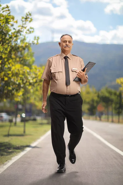 Full Length Portrait Security Guard Walking Pedestiran Lane — Stockfoto