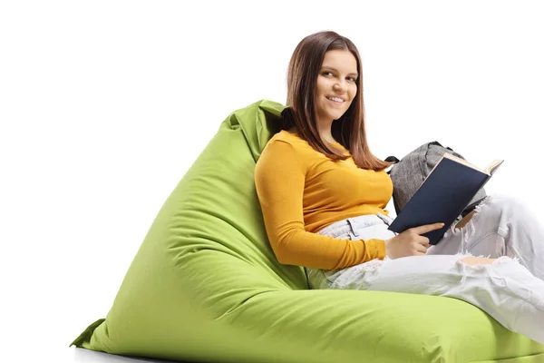 Student Sitting Green Beanbag Book Smiling Camera Isolated White Background — Stok Foto