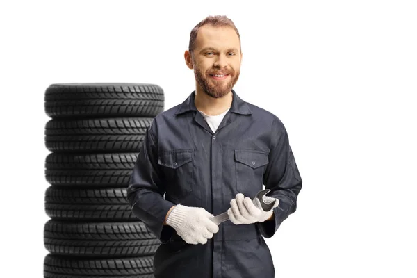 Smiling Mechanic Uniform Tires Holding Wrench Tool Isolated White Background — Zdjęcie stockowe