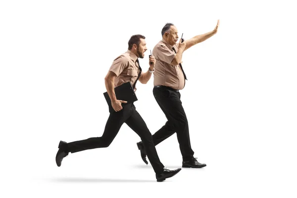 Full Length Profile Shot Two Security Guards Running Using Walkie — Stockfoto