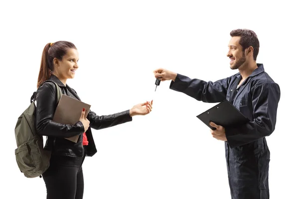 Profile Shot Auto Mechanic Giving Car Keys Young Female Isolated — Stockfoto